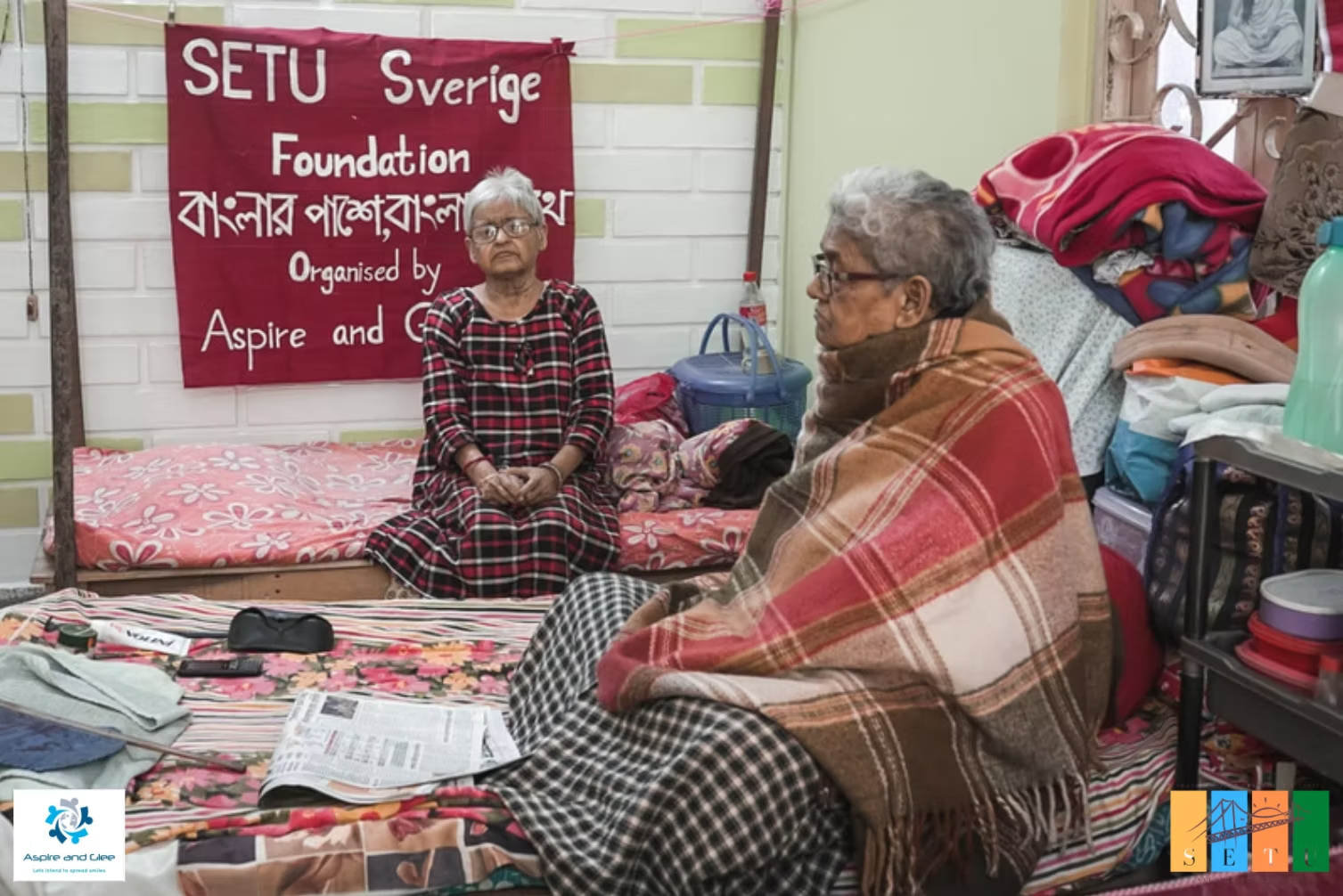 Two elderly residents seated during a Setu Sverige Foundation elder-care visit in West Bengal